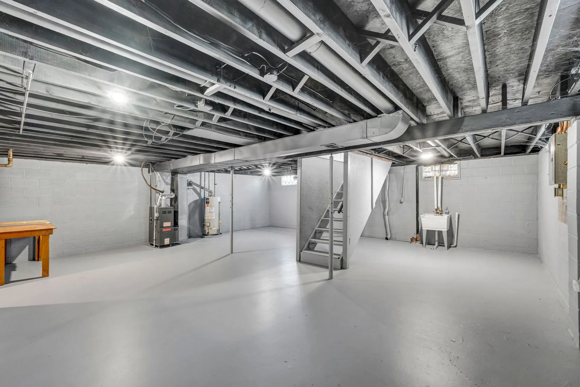 Unfinished basement with concrete floor, the kind of space a dehumidifier runs in